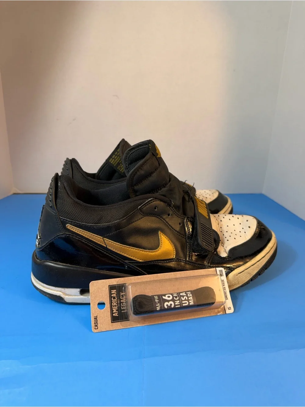 Jordan Black, White & Gold Strap Sneakers